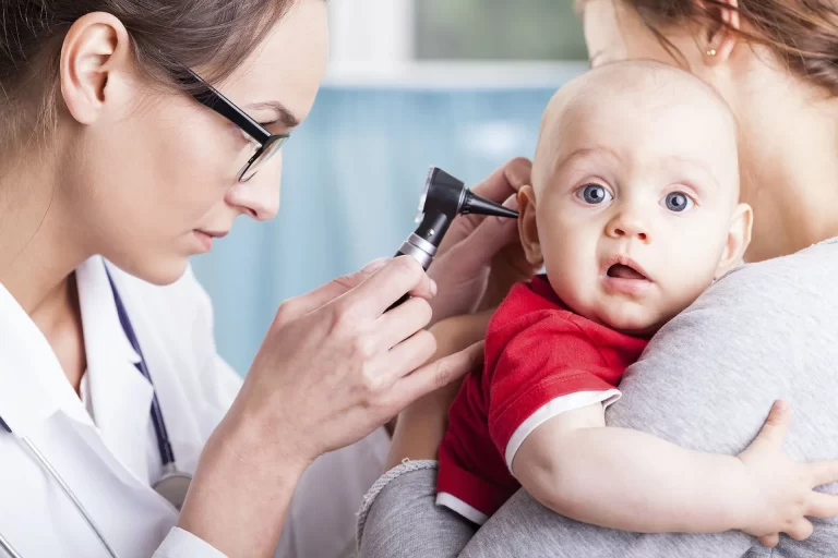Greenwich ENT doctor examining a baby's ear